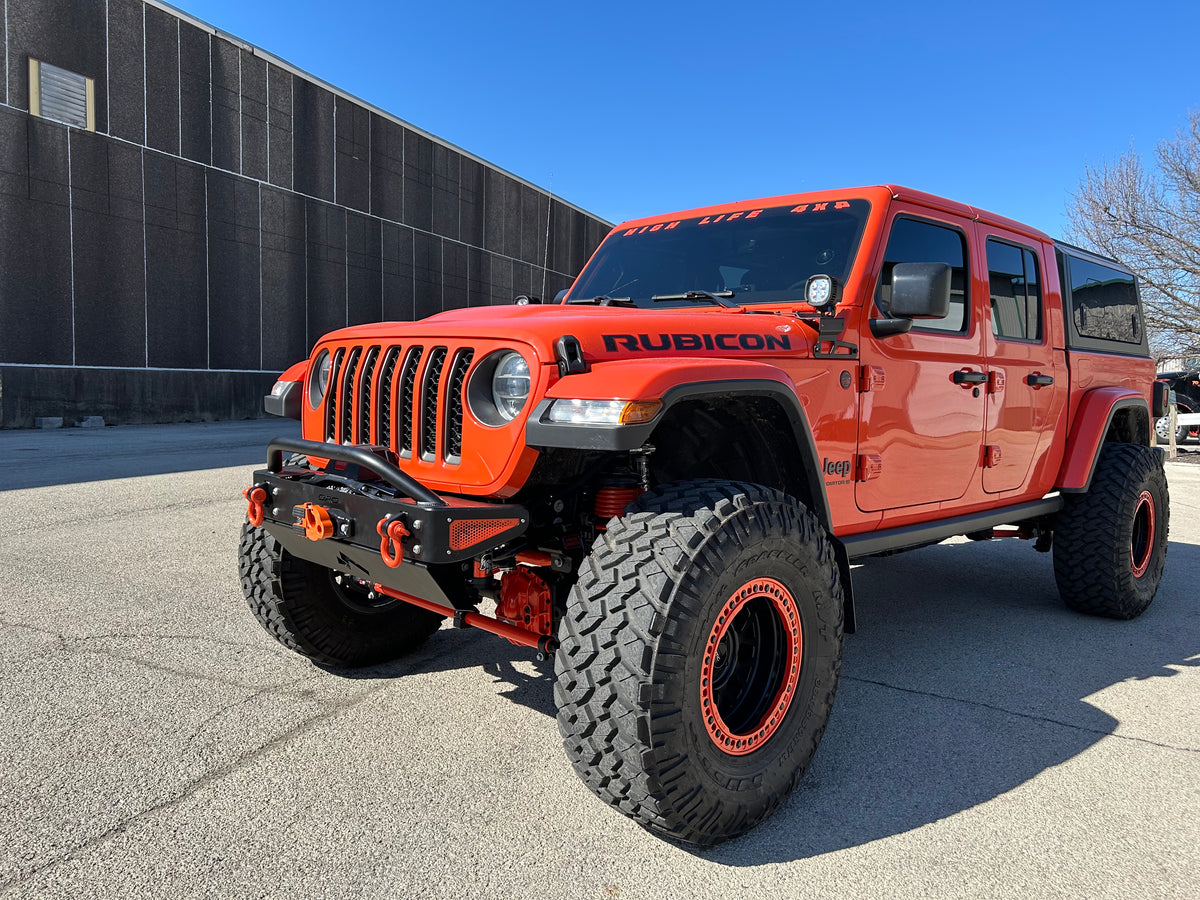 Jeep Wrangler JK, JL, and JT stubby front bumper with bull bar on orange Gladiator on 40s 1