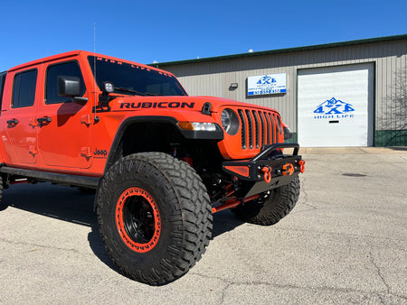 Jeep Wrangler JK, JL, and JT stubby front bumper with bull bar on orange Gladiator on 40s 3