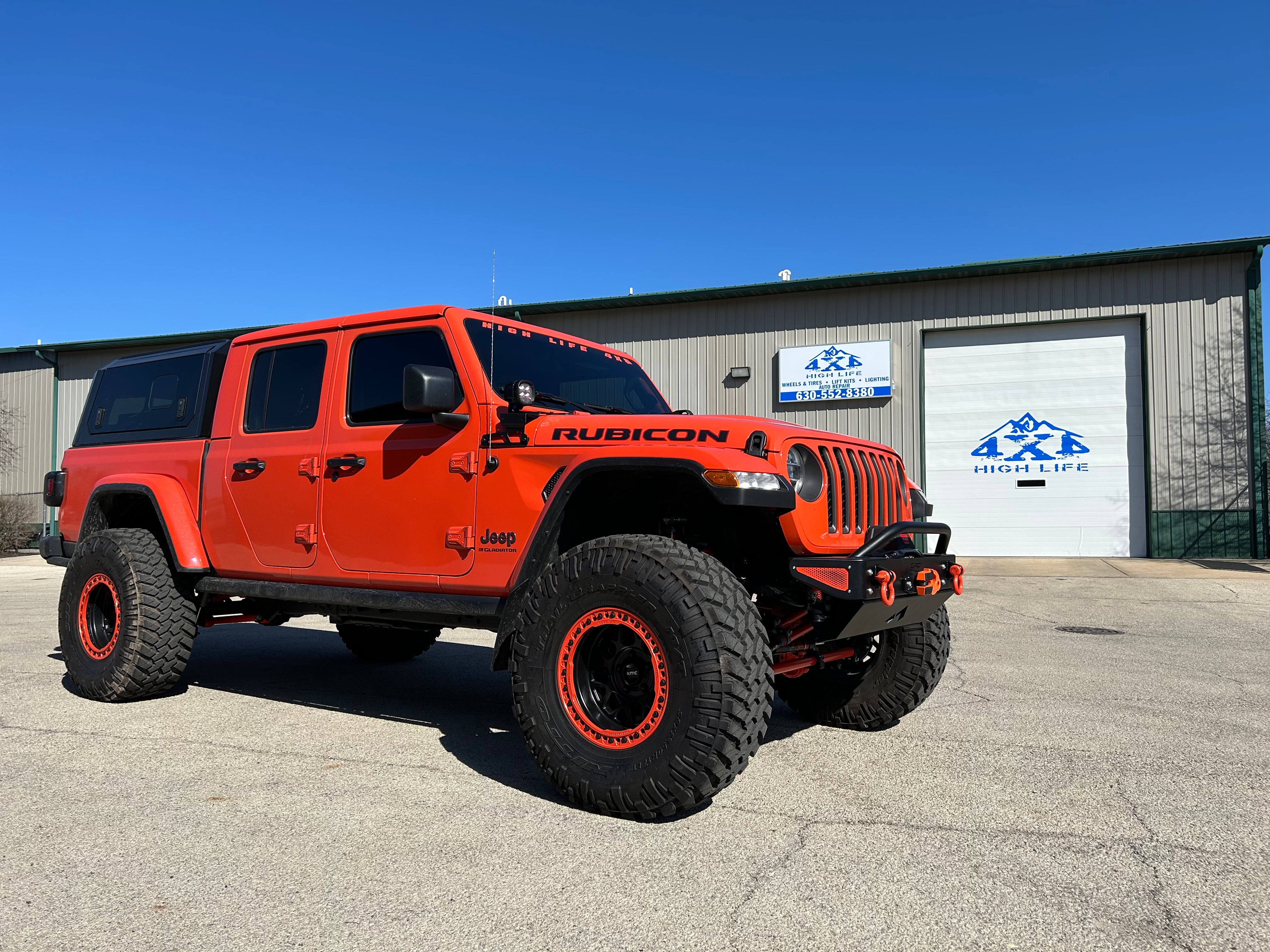 Jeep Wrangler JK, JL, and JT stubby front bumper with bull bar on orange Gladiator on 40s 4