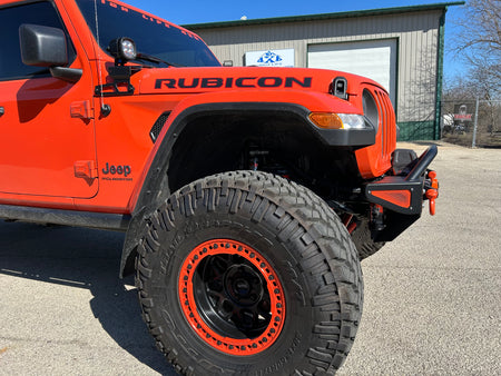 Jeep Wrangler JK, JL, and JT stubby front bumper with bull bar on orange Gladiator on 40s side