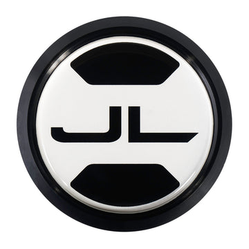A custom round metal jeep fender badge with a unique design. Inside it has the Jeep Wrangler JL symbol. Jeep Wrangler JL fender badge, replacement for Trail Rated Badge. 